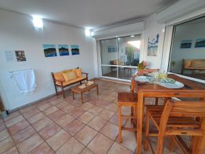 a living room with a table and chairs at Duplex Mariposa in Basse-Terre