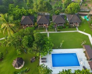 an aerial view of a villa with a swimming pool at Bearlinbungalow in Vang Vieng