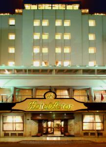 a building with a hotel sign in front of it at Hotel Astor in Mar del Plata