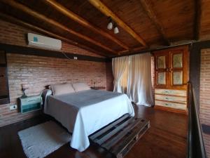 En eller flere senge i et værelse på Kuntur Casas de Campo