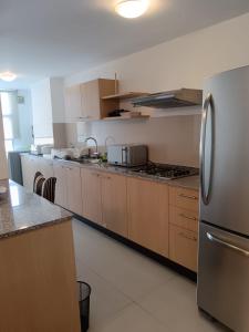 O bucătărie sau chicinetă la Departamento de 2 dormitorios en el corazón de Quito