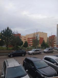 a group of cars parked in a parking lot at Kannon 1 in Caparica