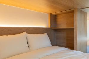 Ένα ή περισσότερα κρεβάτια σε δωμάτιο στο Gudo Collective Gangnam