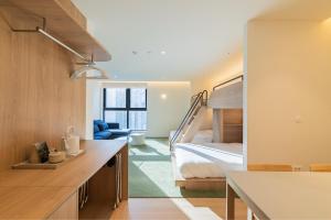 Ένα ή περισσότερα κρεβάτια σε δωμάτιο στο Gudo Collective Gangnam