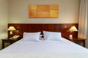 Postel nebo postele na pokoji v ubytování Ellegance Verbo Divino