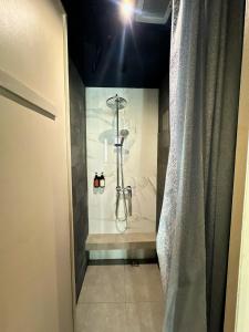 a bathroom with a shower in a room at Althia Private Capsule Quarters in Badung +35 photos