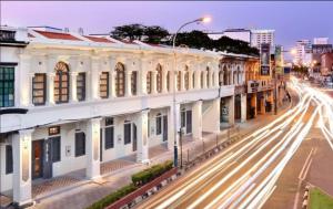 a city street with buildings and traffic at night at Loke Thye Kee Heritage Hotel, Georgetown Penang in George Town