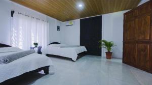 Ένα ή περισσότερα κρεβάτια σε δωμάτιο στο Cabaña Los Ángeles, Fortuna