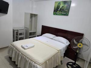 Ένα ή περισσότερα κρεβάτια σε δωμάτιο στο Hospedaje Paraíso +14 φωτογραφίες