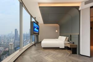 Postel nebo postele na pokoji v ubytování Atour S Hotel Wuhan Mixc Xinhua Road + 56 fotografií
