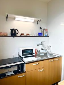 Η κουζίνα ή μικρή κουζίνα στο 匠ファームステイ