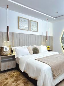 Ένα ή περισσότερα κρεβάτια σε δωμάτιο στο Oria homes