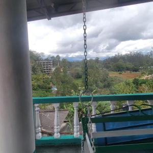 a swing on a balcony with a view at Policekanda View in Diyatalawa +3 photos