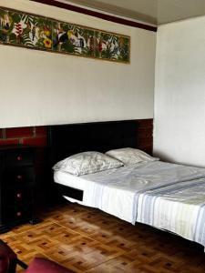 Ένα ή περισσότερα κρεβάτια σε δωμάτιο στο piedras del ocaso manizales