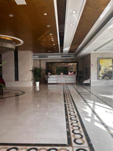 a lobby with a bowling alley in a building at Pu Yu Apartment in Shanghai