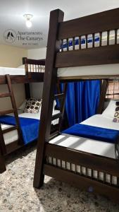 a group of bunk beds in a room at Apartamento thecanarys in Santa Rosa de Cabal
