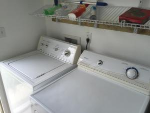 a laundry room with a washer and dryer at spacious one Bedroom mobil home in Harlingen