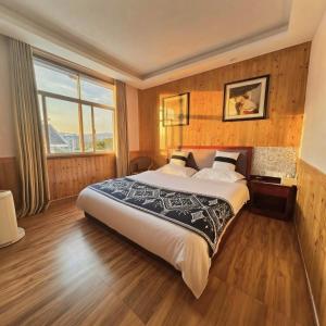 En eller flere senge i et værelse på January Inn