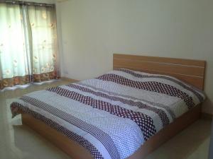 Postel nebo postele na pokoji v ubytování The Prince Residence , Chiang Rai