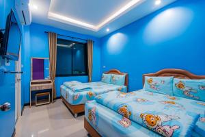 Ένα ή περισσότερα κρεβάτια σε δωμάτιο στο บ้านพักชะอำ ณิสราพูลวิลล่า