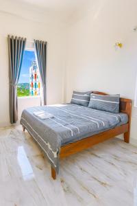 Ένα ή περισσότερα κρεβάτια σε δωμάτιο στο K Hotel Phú Quý