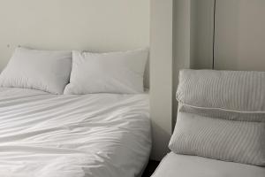 Giường trong phòng chung tại 스테이머물다 event suite