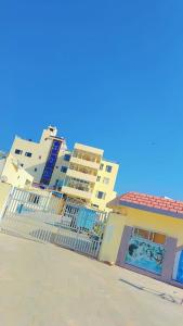 a building on the beach with a fence in front of it at Hill view resort in Jaipur