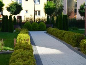 Vonkajšia záhrada v ubytovaní Apartamenty Szczęśliwe Sny