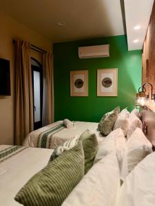 Postel nebo postele na pokoji v ubytování Hotel Boutique Casa Gopar