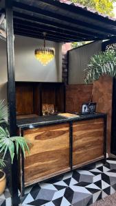 a kitchen with a wooden counter with a chandelier at L2 Darbar Kothi Heritage Living in Jodhpur +36 photos