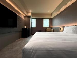 Postel nebo postele na pokoji v ubytování Hub Hotel Xintai