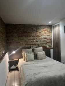 Postel nebo postele na pokoji v ubytování Les Pierres de Rinaldi + 3 fotografie