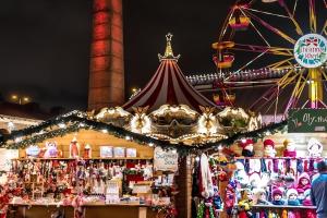 a carnival with a circus tent and a ferris wheel at Apeiron Acropolis Suites in Athens