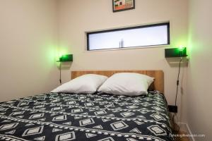 Ένα ή περισσότερα κρεβάτια σε δωμάτιο στο Appartement pieds des pistes et commerces