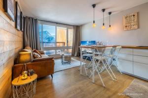 Χώρος καθιστικού στο Appartement pieds des pistes et commerces