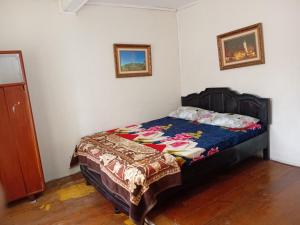 a bedroom with a bed in a room at Elle Maya Sari in Kotabaru +7 photos