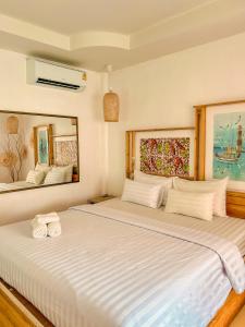 Ένα ή περισσότερα κρεβάτια σε δωμάτιο στο โลมา พูลวิลล่า เกาะล้าน