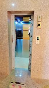 a room with a door with a scale on the wall at Hill view resort in Jaipur