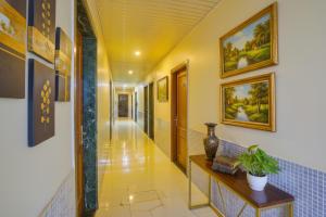 TV a/nebo společenská místnost v ubytování Via Atithi