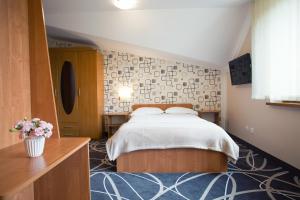 Posteľ alebo postele v izbe v ubytovaní Hotel Nad Nettą