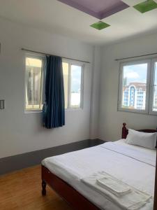 Кровать или кровати в номере Hoang Hai Dang 1 Hotel +9 фотографий