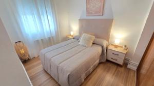 Ένα ή περισσότερα κρεβάτια σε δωμάτιο στο Apartamento La Manchuela +2 φωτογραφίες