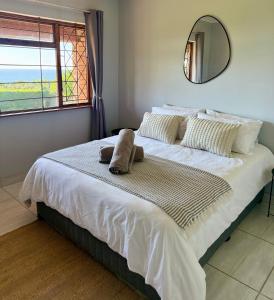 Ένα ή περισσότερα κρεβάτια σε δωμάτιο στο Kingfish Cove