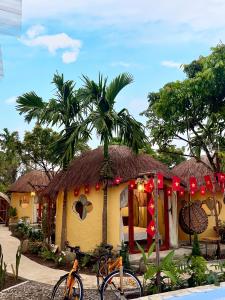 a house with two bikes parked in front of it at Tam Coc Sora - Traditional Home - Center in Vũ Lâm