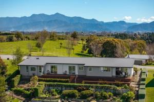 a large house with a garden in front of it at Fairhall view 