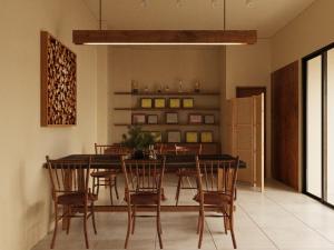 a dining room with a table and chairs at PhaTea Neoclassical Style Building - near Old Quarter in Hanoi
