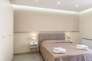 Ένα ή περισσότερα κρεβάτια σε δωμάτιο στο Alma Mare