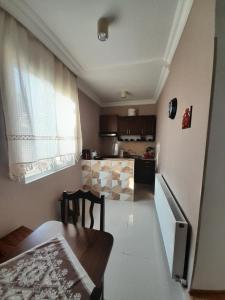 a small kitchen with a table and a dining room at Apartment 9 in Mtskheta