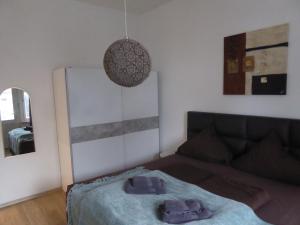 En eller flere senge i et værelse på Villa Augusta