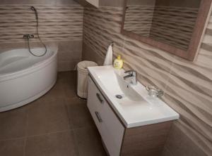 Koupelna v ubytování Apartment Central Haven + 17 fotografií